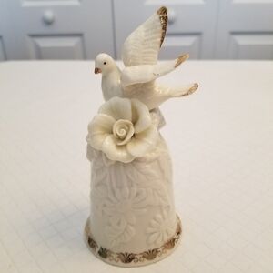 Cream porcelain dove bell with flower
